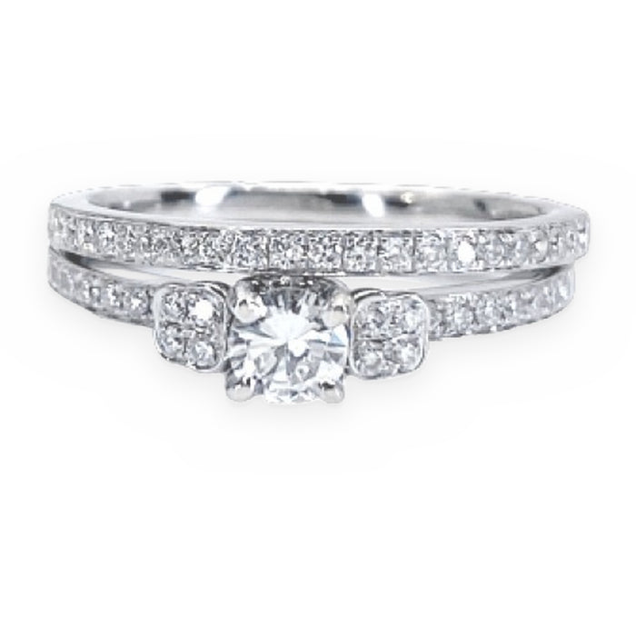 White gold round diamond engagement ring with pave-set shoulders and band