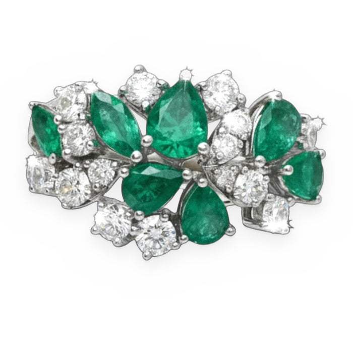 White gold cluster ring with pear-shaped emeralds and round diamonds