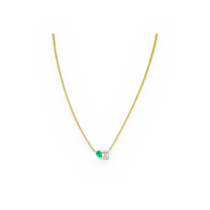 Yellow gold toi et moi necklace with a pear emerald and an emerald-cut diamond